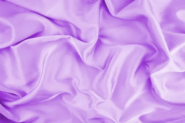 Violet chiffon fabric texture for background. Silk fabric. Selective focus.