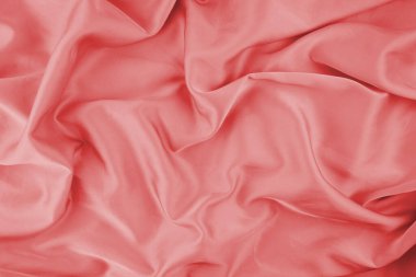 Arka plan için kırmızı şifon kumaş dokusu. İpek kumaş. Seçici odak.