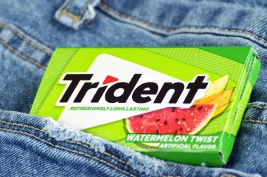 Kharkiv, Ukraine - February 10, 2023: Trident chewing gum on jeans background. clipart