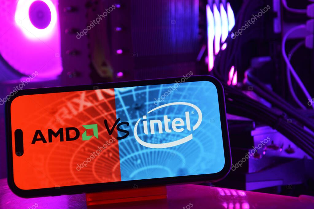 Kharkiv, Ukraine - January 28, 2025: Phone with AMD and INTEL logo on computer background.