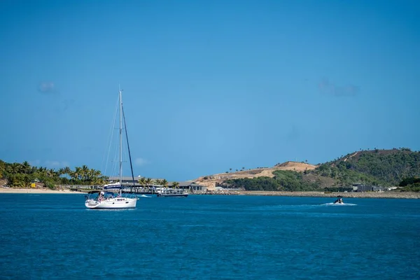 stock image tourist boats and tour boats in the whitsundays queensland, australia. travellers on the great barrier reef, over coral and fish. tourism yachts of young people