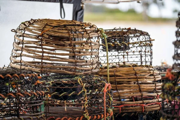 crayfish traps on a fishing boat. lobster wooden pots on the back of a fishing ship in australia in fishing season