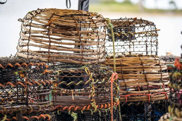 crayfish traps on a fishing boat. lobster wooden pots on the back of a fishing ship in australia in fishing season