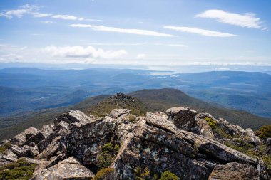 hiking up to the summit of a rocky mountain in australia in spring