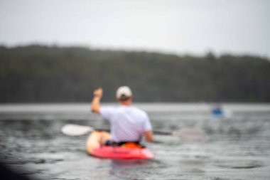 kayaking on a river in america with friends in summertime