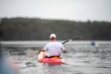 friends going for a kayak on a lake in summer time in america