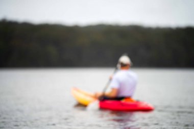 friends going for a kayak on a lake in summer time in america
