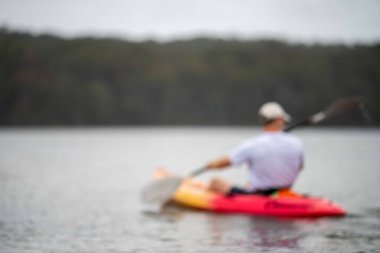 friends going for a kayak on a lake in summer time in america