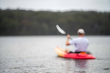 friends going for a kayak on a lake in summer time in america