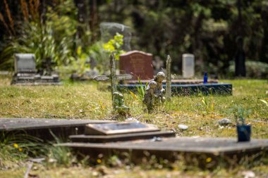 cemetery graves and cross in a graveyard in a church