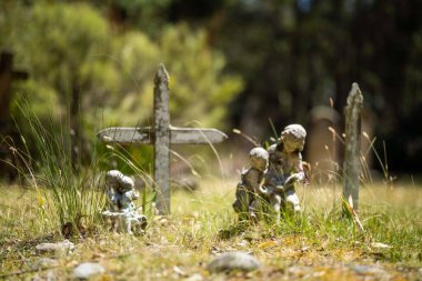 cemetery graves and cross in a graveyard in a church
