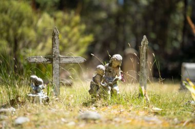 cemetery graves and cross in a graveyard in a church