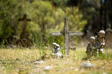 cemetery graves and cross in a graveyard in a church