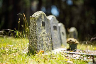 cemetery graves and cross in a graveyard in a church