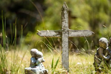 cemetery graves and cross in a graveyard in a church