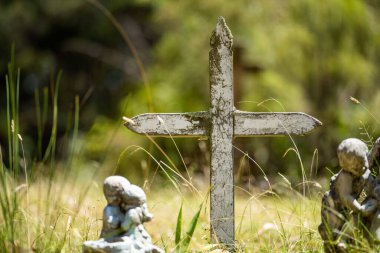 cemetery graves and cross in a graveyard in a church