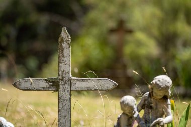 cemetery graves and cross in a graveyard in a church