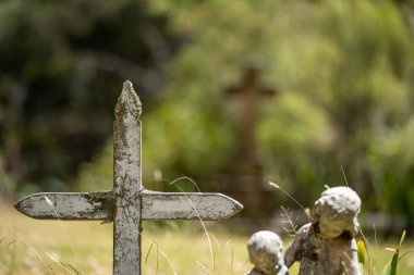 cemetery graves and cross in a graveyard in a church