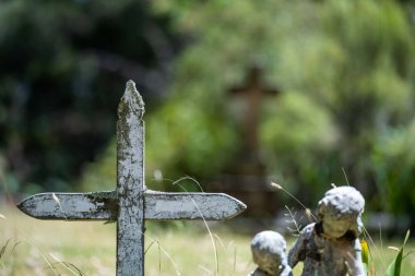 cemetery graves and cross in a graveyard in a church