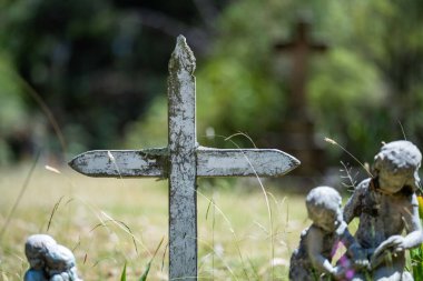 cemetery graves and cross in a graveyard in a church