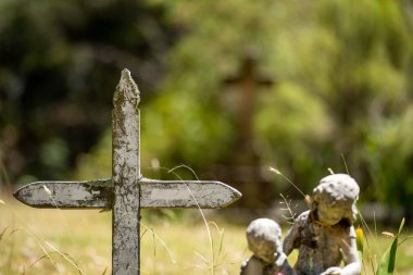 cemetery graves and cross in a graveyard in a church