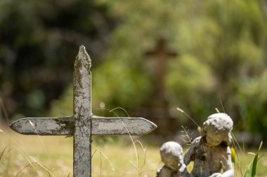 cemetery graves and cross in a graveyard in a church