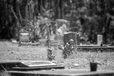 cemetery graves and cross in a graveyard in a church
