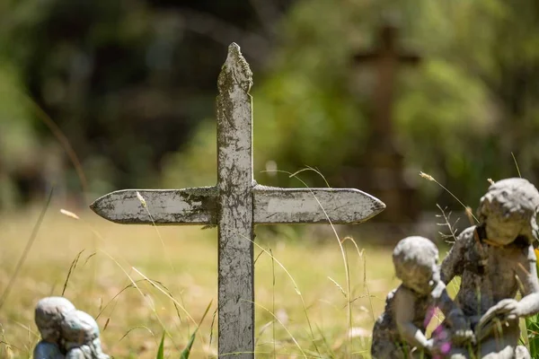 cemetery graves and cross in a graveyard in a church