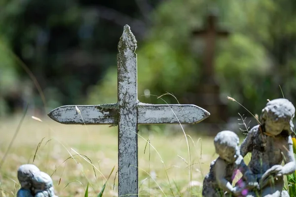 cemetery graves and cross in a graveyard in a church