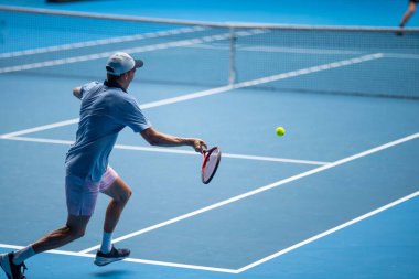 Professional athlete Tennis player playing on a court in a tennis tournament in summer in australia