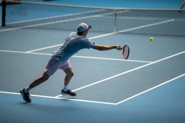 athlete playing tennis. Amateur female tennis player hitting a forehand playing tennis summer  clipart