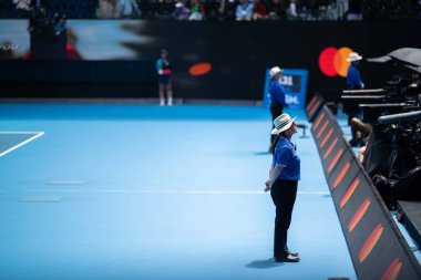 public event with security guards on court at the tennis in melbourne australia in summer