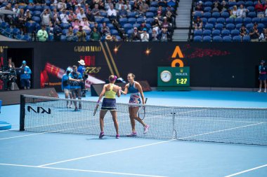 Beautiful female athlete playing tennis. Amateur female tennis player hitting a forehand playing tennis in a match