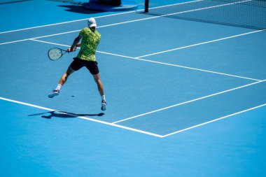 Professional athlete Tennis player playing on a court in a tennis tournament in summer in america
