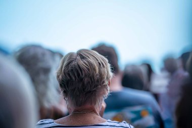 fans watching a sporting match and sporting event in a stadium in spring