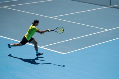 fans watching a sporting match and sporting event in a stadium in spring