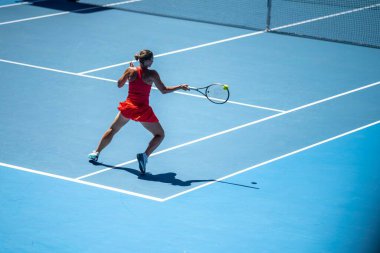 tennis fan watching a tennis match at the australian open eating food and drinking in australia