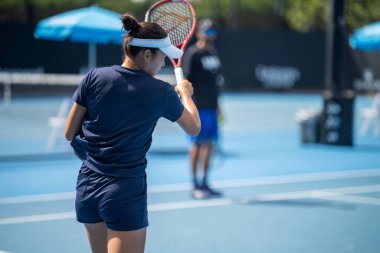 fans watching a sporting match and sporting event in a stadium