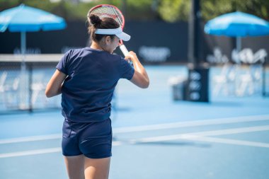 fans watching a sporting match and sporting event in a stadium