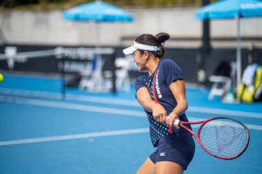 fans watching a sporting match and sporting event in a stadium