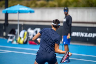 fans watching a sporting match and sporting event in a stadium