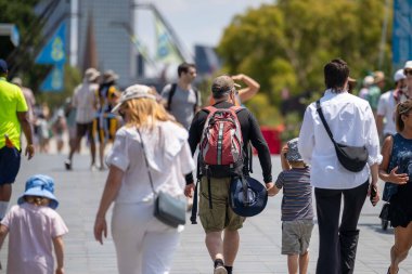 Amateur playing tennis at a tournament and match on grass in Melbourne, Australia in summer