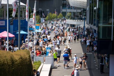 fans watching a sporting match and sporting event in a stadium
