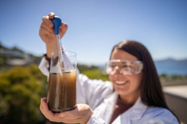 Soil test, female agricultural scientist conducting a soil test in a scientific lab in. soil agricultural agronomist in australia, soil microbial test in a scientific lab. 