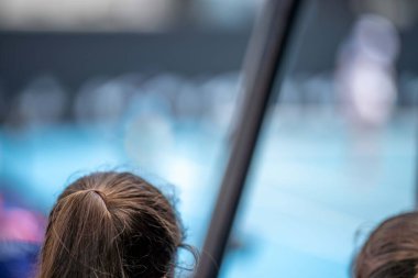 tennis fan watching a tennis match at the australian open eating food and drinking
