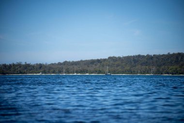beautiful island on a blue ocean in summer at dusk