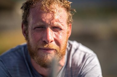 tennis fan watching a tennis match at the australian open eating food and drinking	