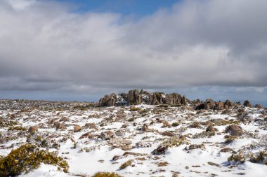 kunanyi mt wellington covered in snow and ice above hobart in winter clipart