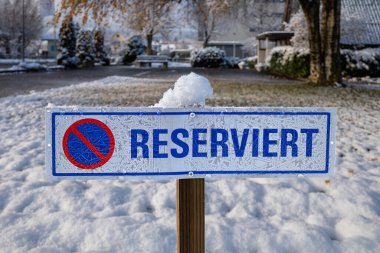 Birr, France - December 12, 2022: A german sign in the parking lot indicating the reservation of a parking space.