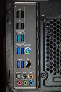 The back of the desktop computer with various inputs, USB sockets, fan